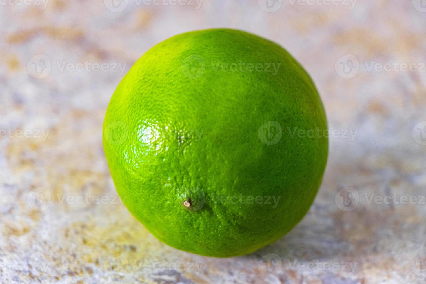 Green ripe lime lime citrus fruit on the table in Mexico. photo
