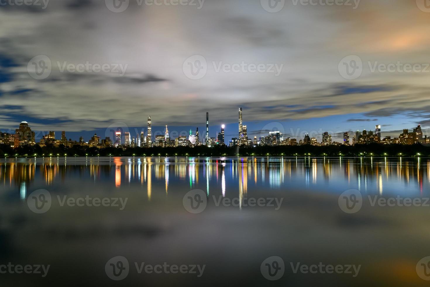 Manhattan Skyline view at night from Central Park across the Central Park Reservoir. photo