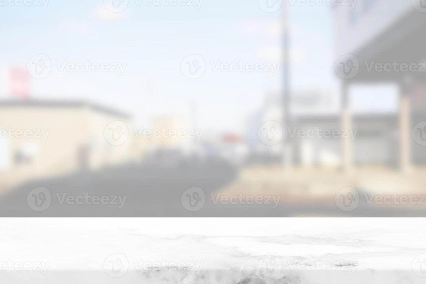 White Marble Table with Blurred Train Station and Overpass Background. photo