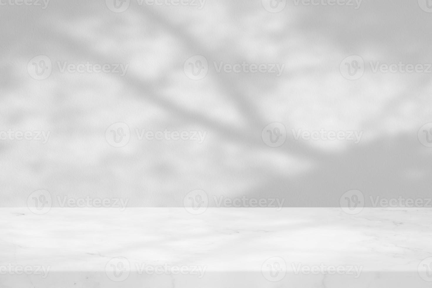 White Marble Table with Tree Shadow on Concrete Wall Texture Background, Suitable for Product Presentation Backdrop, Display, and Mock up. photo