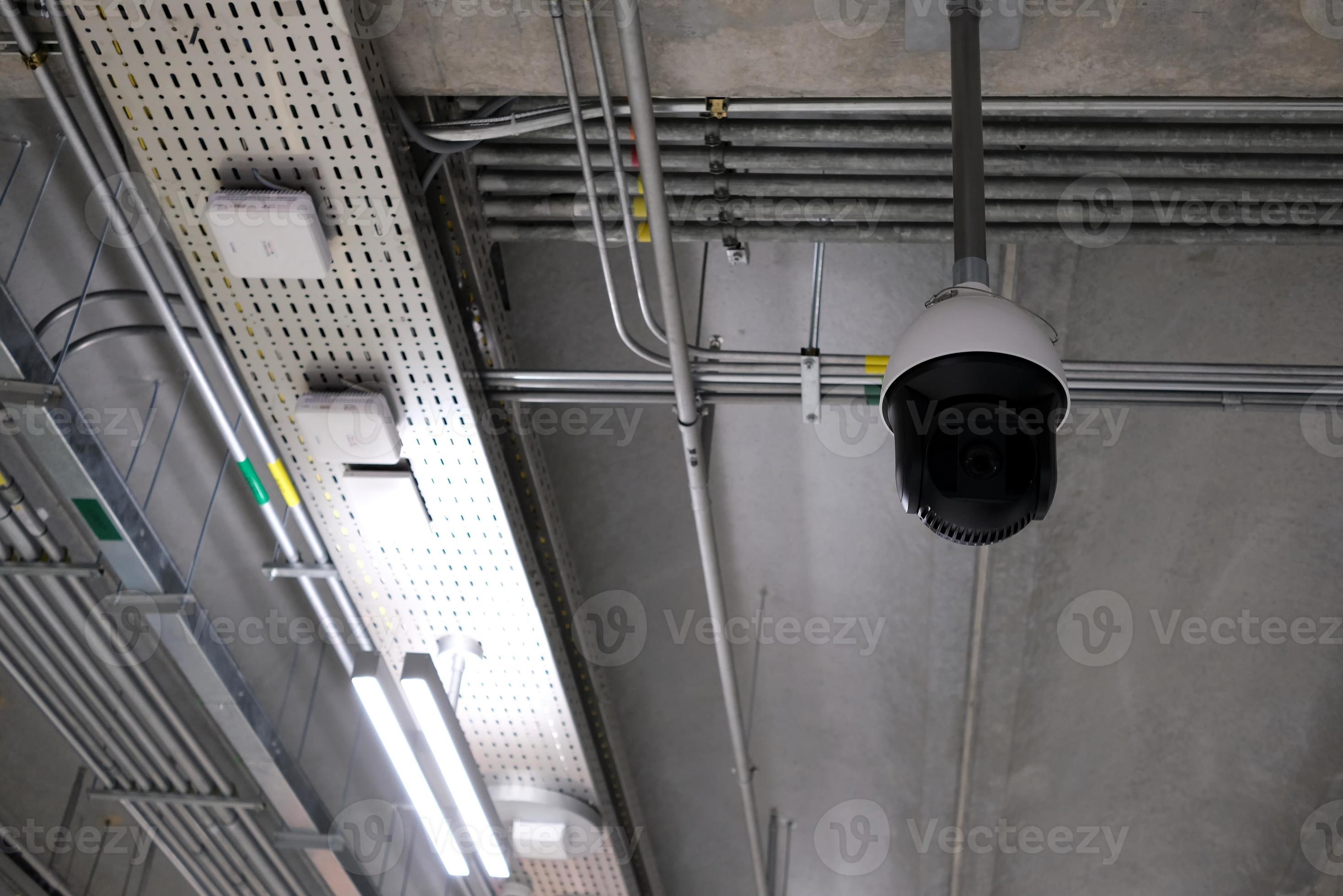 Surveillance Camera Hanging on Concrete Ceiling. 19962492 Stock Photo ...