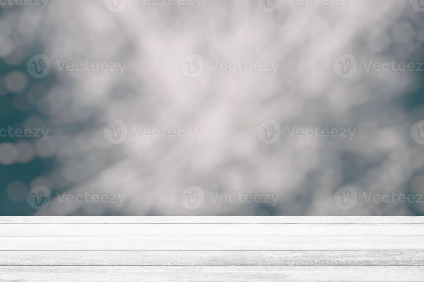 White Wood Table with Blurred White Bokeh Background, Suitable for Product Display and Business Concept. photo