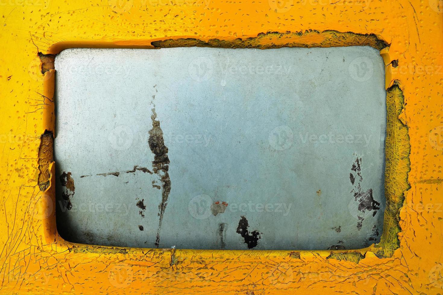 Close up of Old Trash Lid on Yellow Bin Background. photo