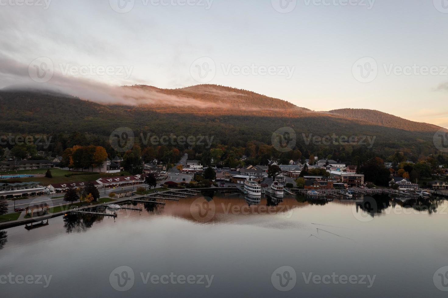 Lake George, New York - October 10, 2021, Tourist boats in the bay in Lake George, New York at dawn. photo