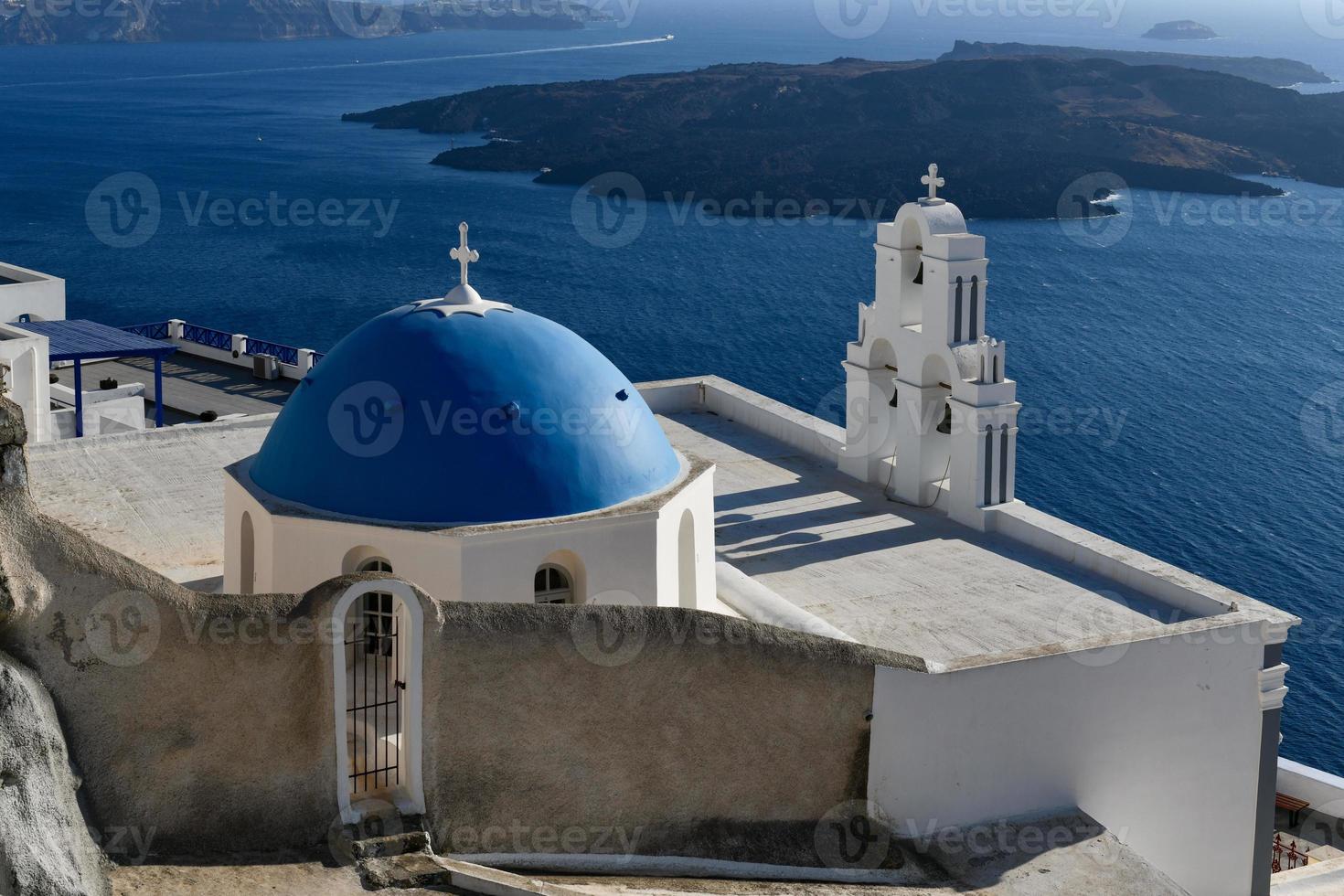 Three Bells of Fira, Santorini, Greece, officially known as The Catholic Church of the Dormition, is a Greek Catholic church on the island of Santorini. photo