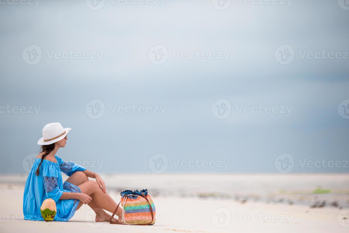 Beautiful young woman on the beach photo