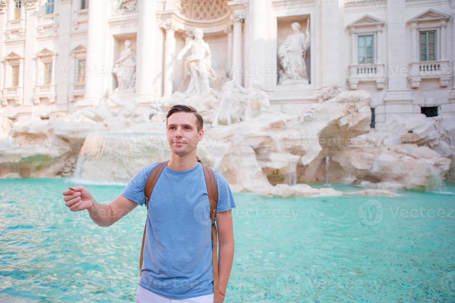 Man in Trevi Fountain, Rome, Italy photo