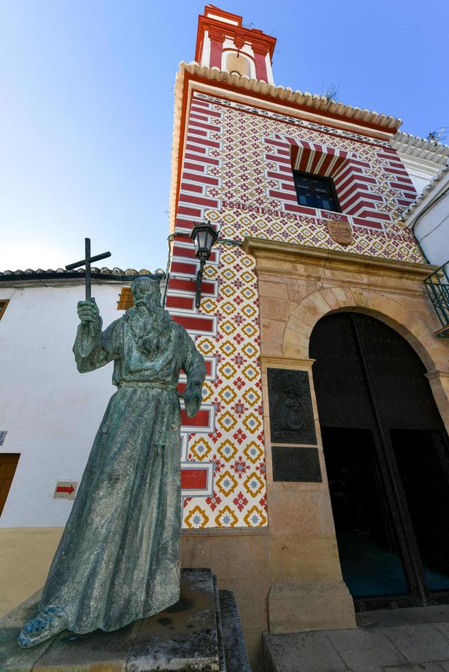 Ronda, Spain - Dec 1, 2021, The statue of Fray Diego Jose de Cadiz, located in front of Iglesia de Nuestra Senora de La Paz, in Ronda. His bones are in the church. photo