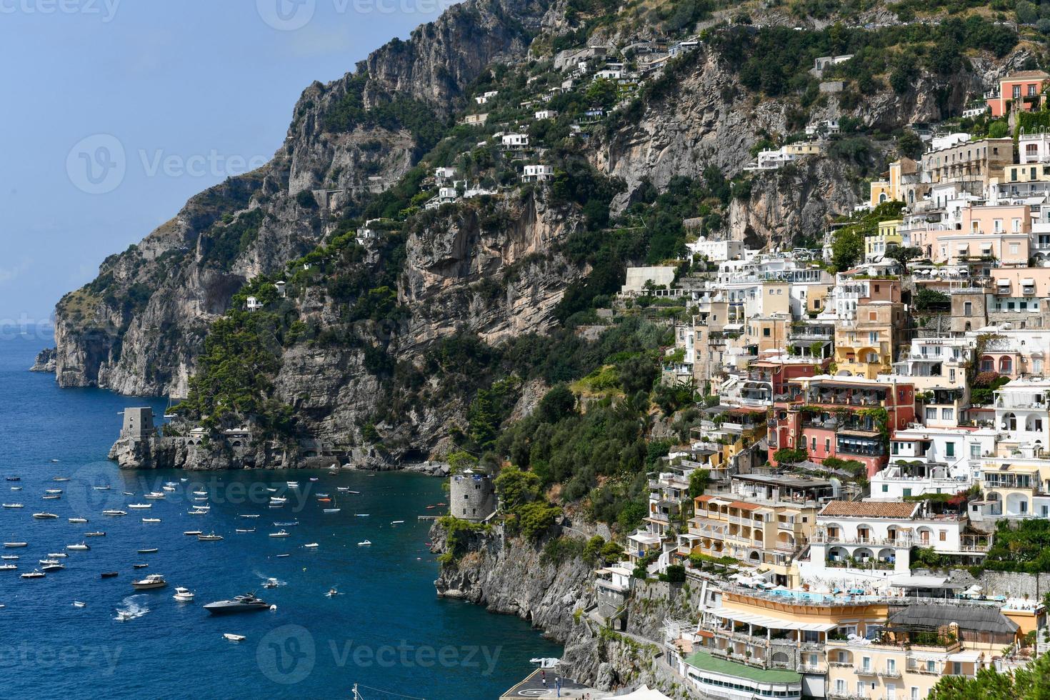 Aerial view of Positano with comfortable beach and blue sea on Amalfi Coast in Campania, Italy. Amalfi coast is popular travel and holyday destination in Europe. photo