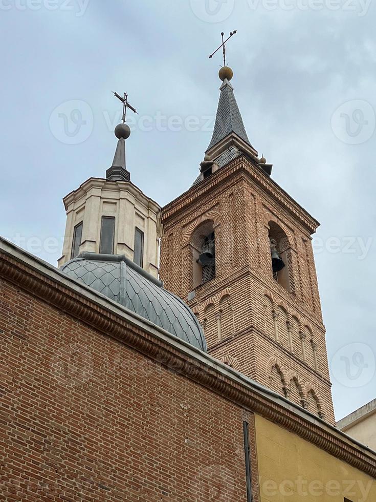 Baroque facade of the Saint Nicholas church Iglesia de San Nicolas in Madrid, Spain photo