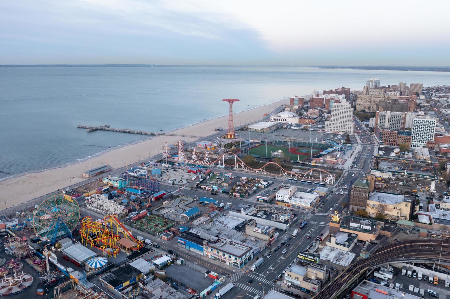 New York - Nov 4, 2021, Aerial view along Coney Island and the Cyclone Rollercoaster in Brooklyn, New York at sunrise. photo