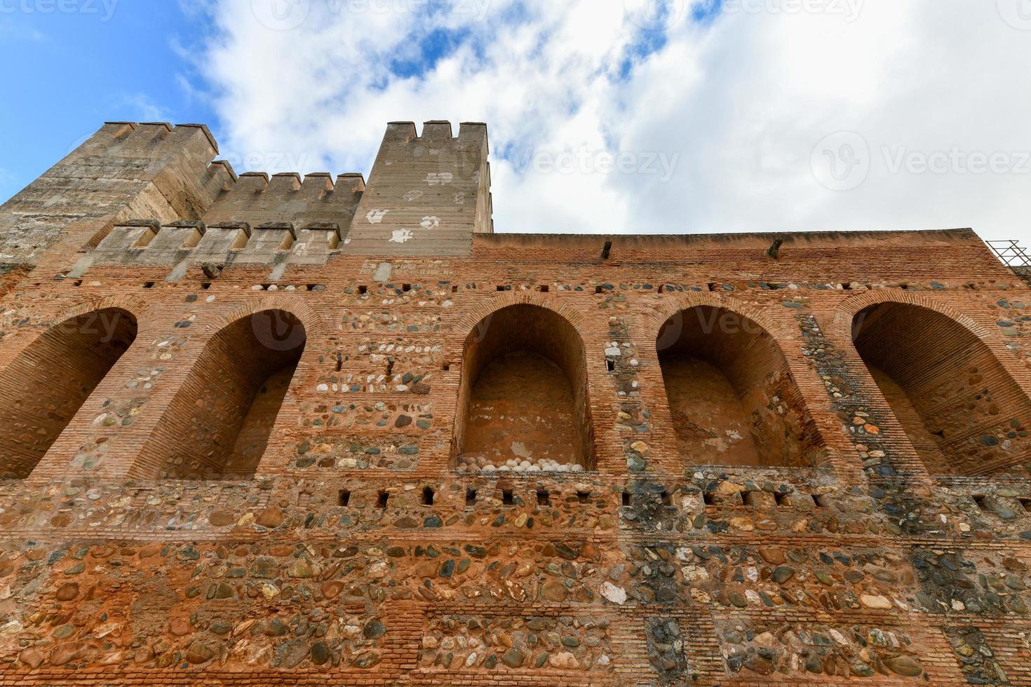 Ancient fortified Broken and Homage towers of Alcazaba military area of Alhambra fortress Granada, Andalusia, Spain. photo