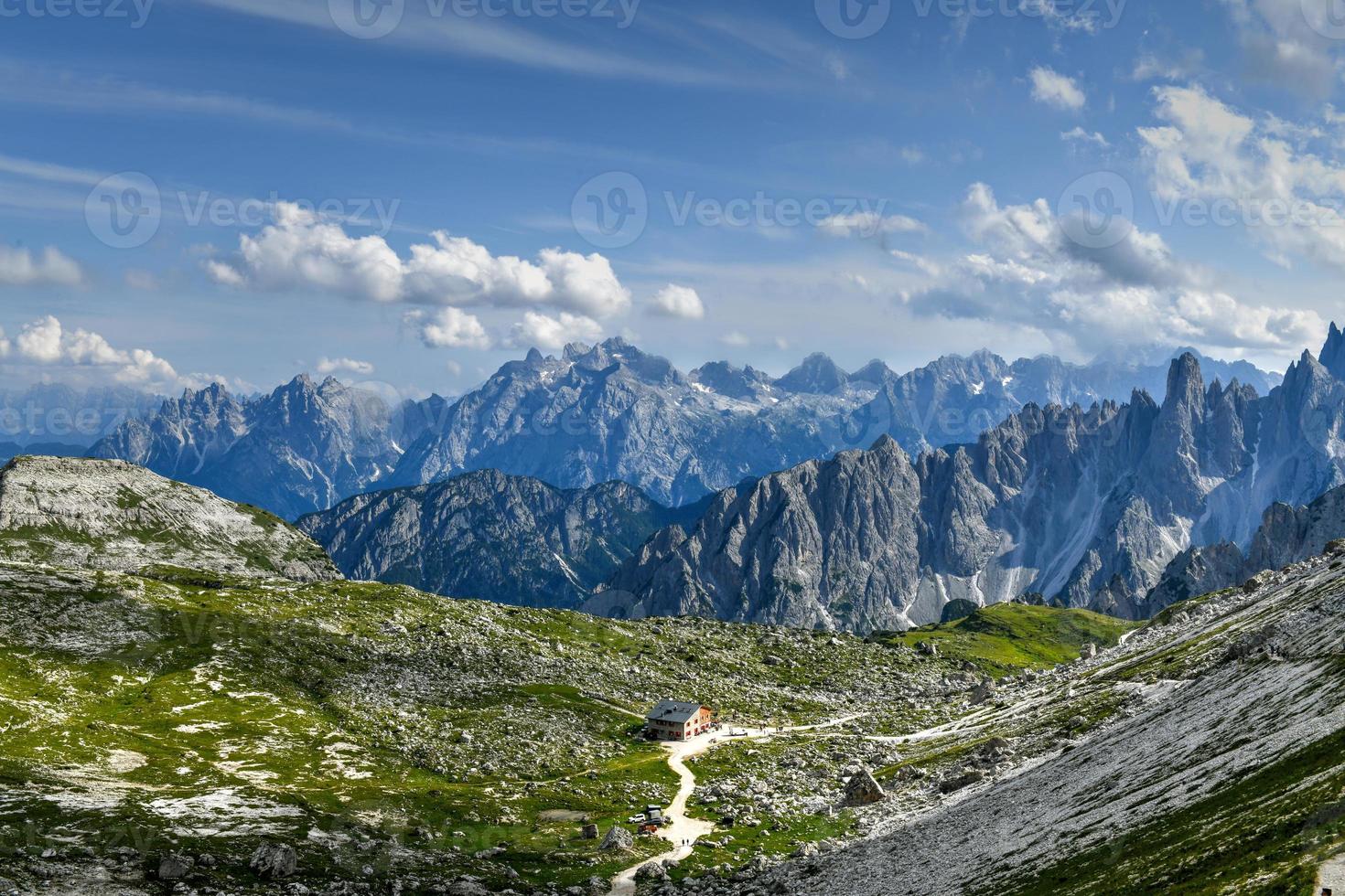 Beautiful sunny day in Dolomites mountains. View on Tre Cime di Lavaredo - three famous mountain peaks that resemble chimneys. photo