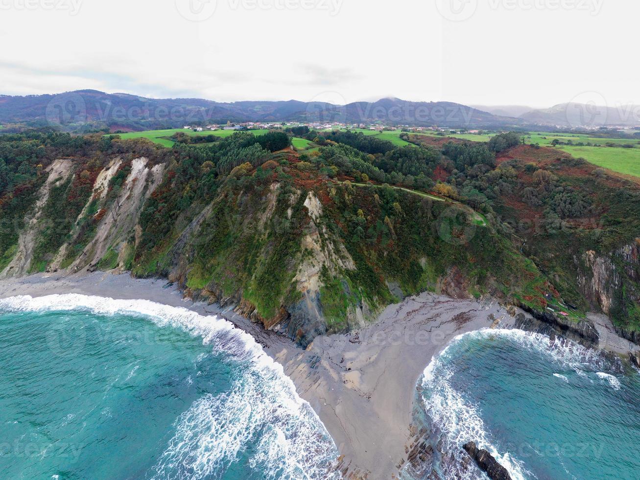 Gueirua beach, located in Asturias, Spain on a cloudy day. photo