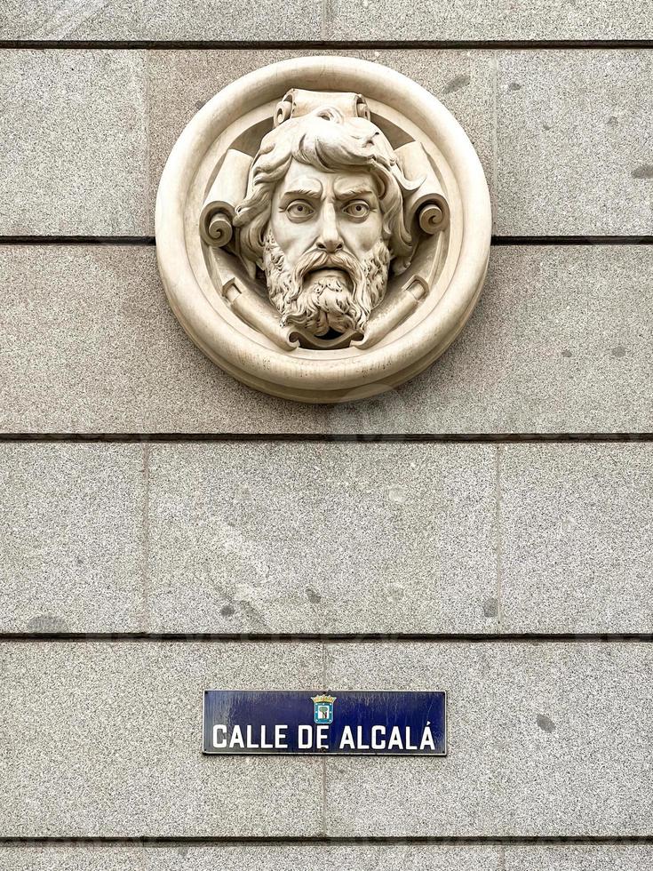 Street sign and artistic decoration along the famous Calle de Alcala  Alcala Street  in Madrid, Spain. photo