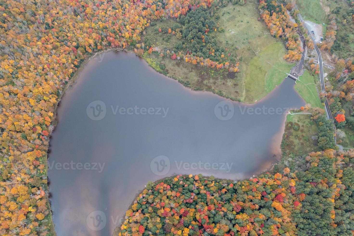 Colgate Lake in Upstate New York during peak fall foliage season. photo