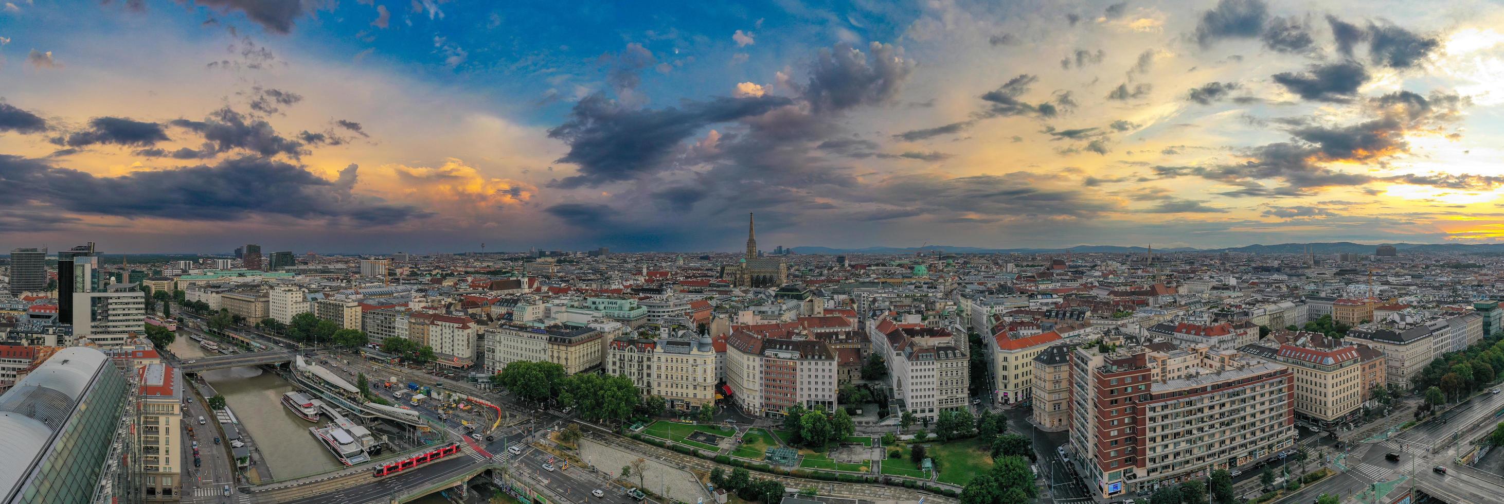 Vienna, Austria - Jul 18, 2021, View of the Danube Canal and Vienna Skyline with St. Stephen's Cathedral Vienna, Austria photo