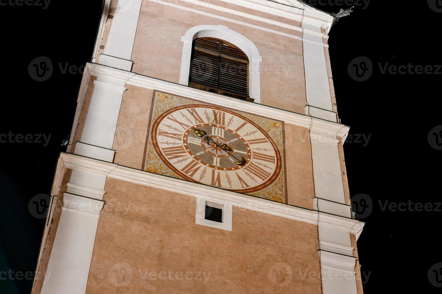 Bell tower of the Church of Saints Peter and Paul in Castelrotto, Italy photo