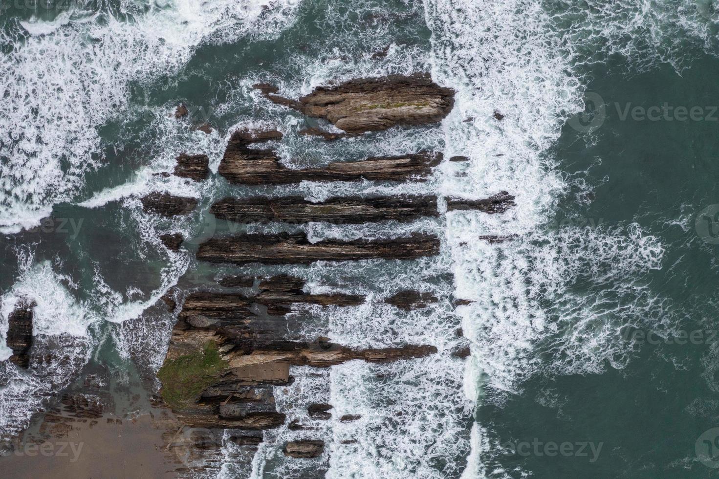 Gueirua beach, located in Asturias, Spain on a cloudy day. photo