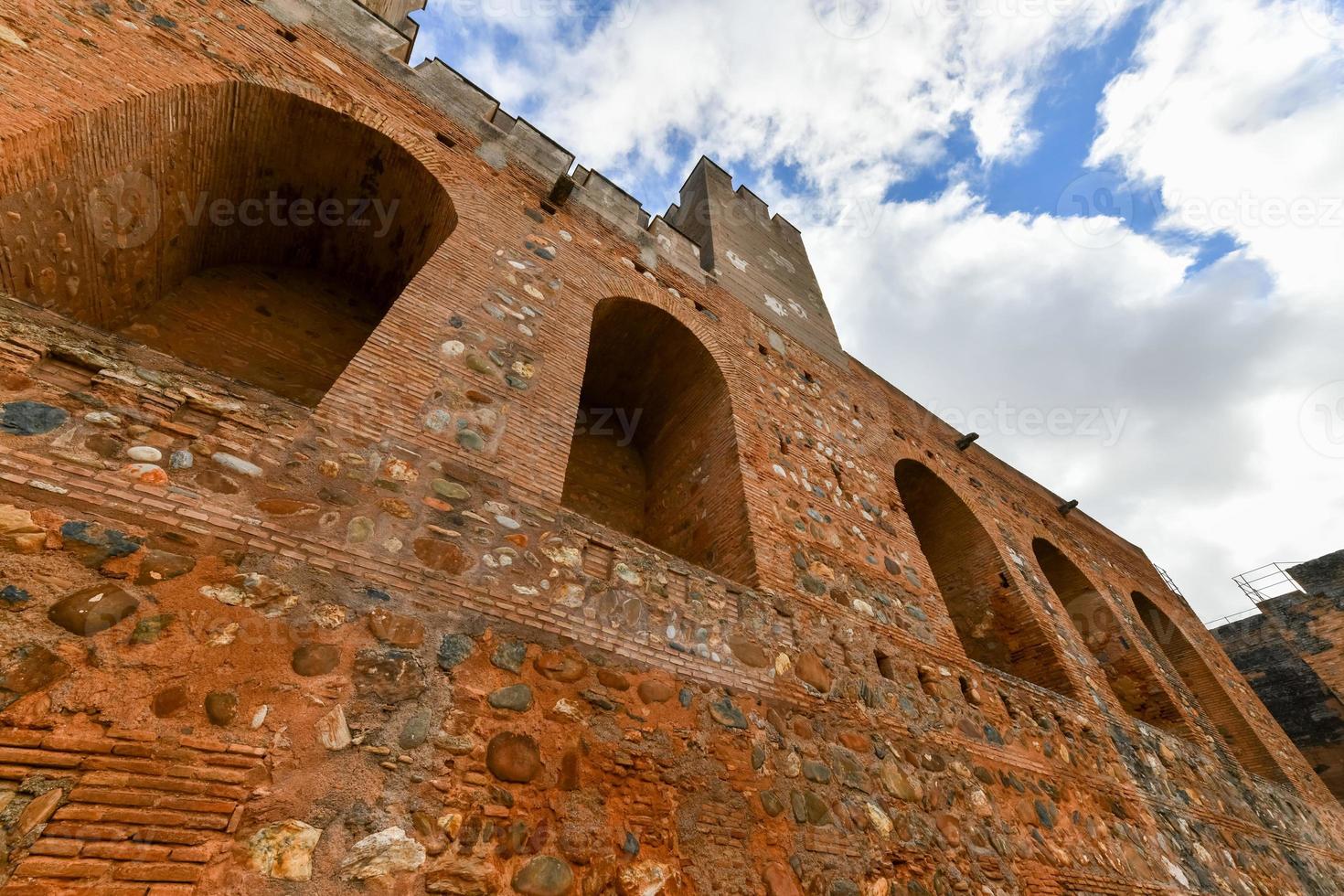 Ancient fortified Broken and Homage towers of Alcazaba military area of Alhambra fortress Granada, Andalusia, Spain. photo