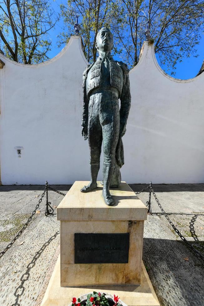 Ronda, Andalusia, Spain - Dec 1 2021, Outdoor statue of bullfighter Antonio Ordonez in front of the bullfighting arena photo