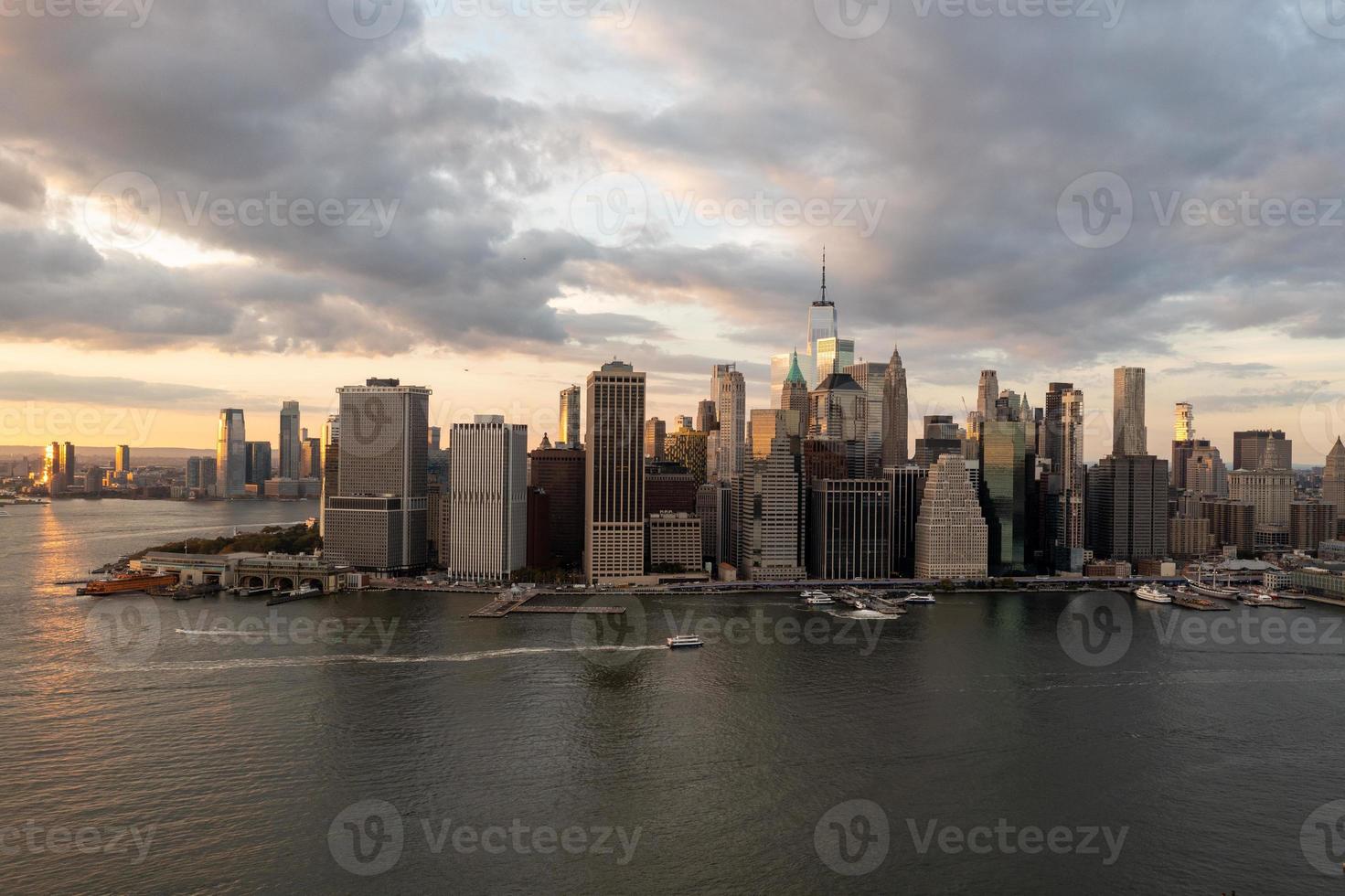 Aerial view of Manhattan in New York City from Brooklyn at sunset. photo
