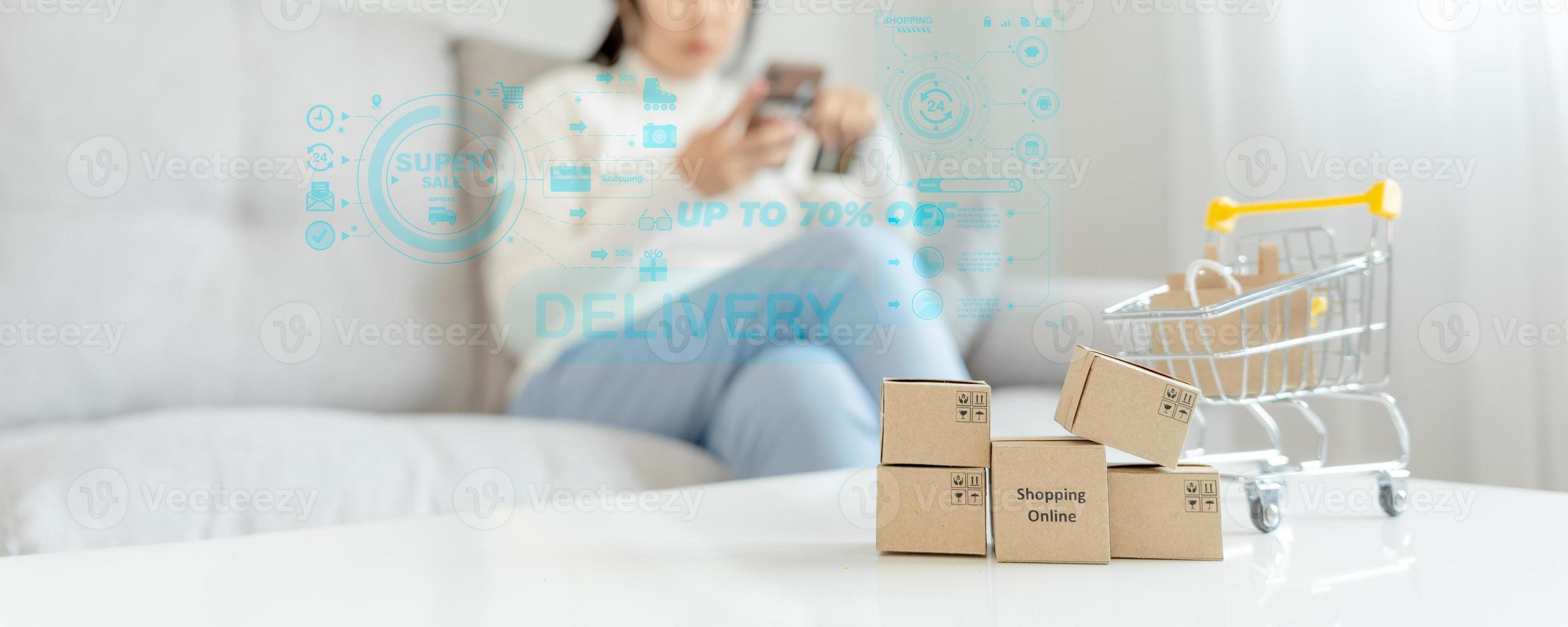 woman using smartphone for online shopping at home. Hand holding mobile phone with payment detail page display and credit card, stay home, technology, electronic commerce, internet, market place photo