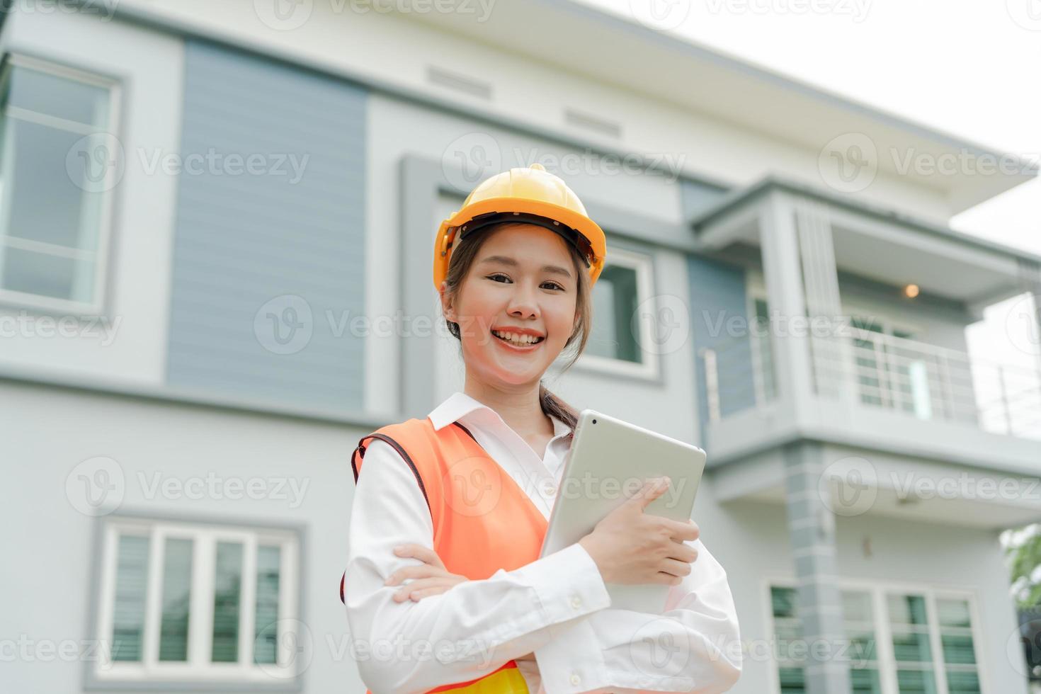 inspector, engineer, Foreman or contactor proudly crosses his arms to inspect the quality of his work. architects work to build the house before handing it over to the homeowner. Develop new estate. photo