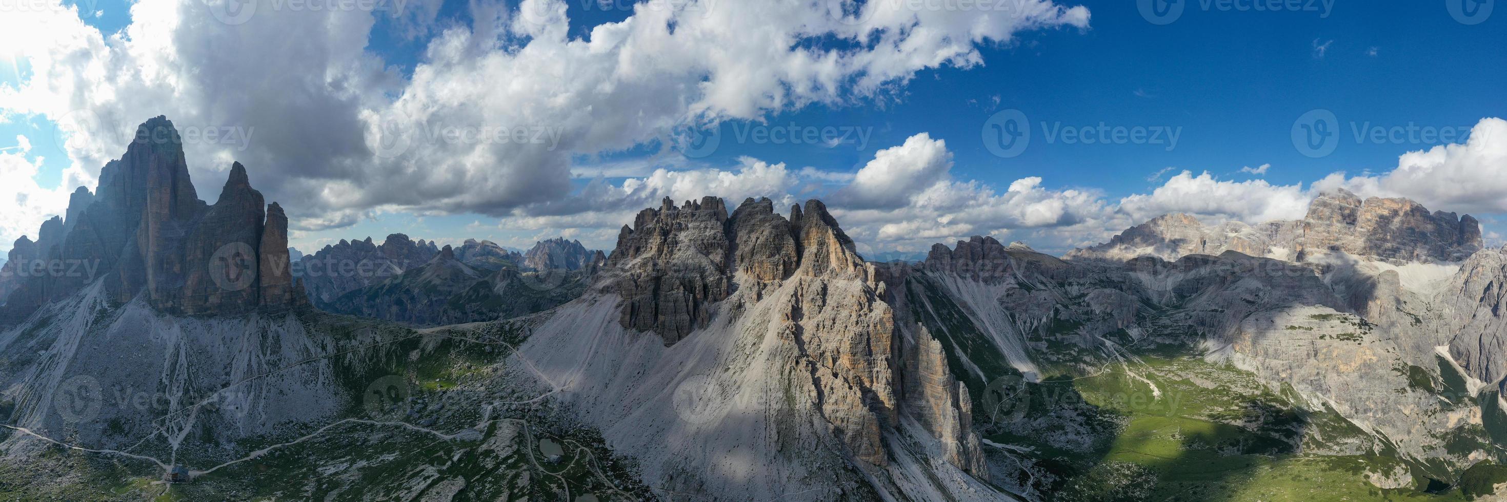 Beautiful sunny day in Dolomites mountains. View on Tre Cime di Lavaredo - three famous mountain peaks that resemble chimneys. photo