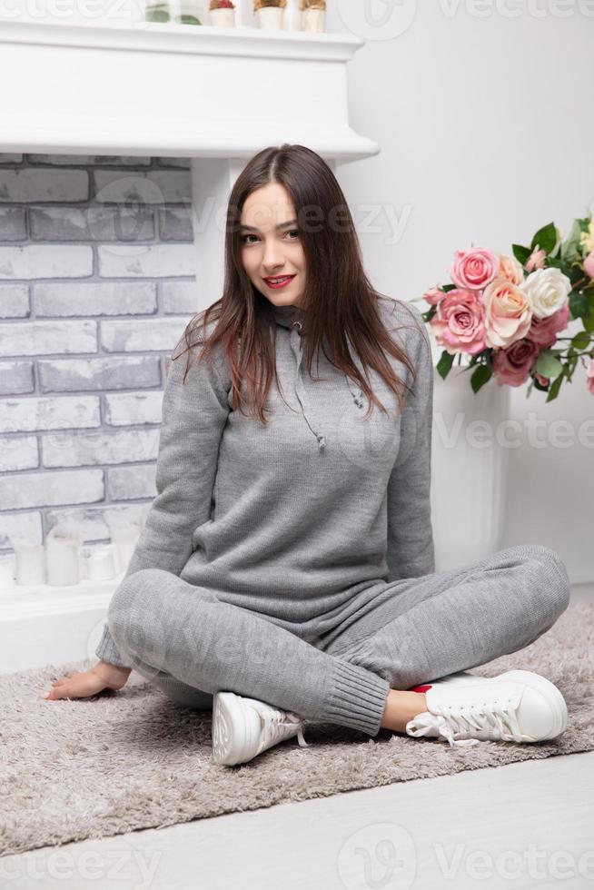 Happy brunette dressed in a gray suit photo