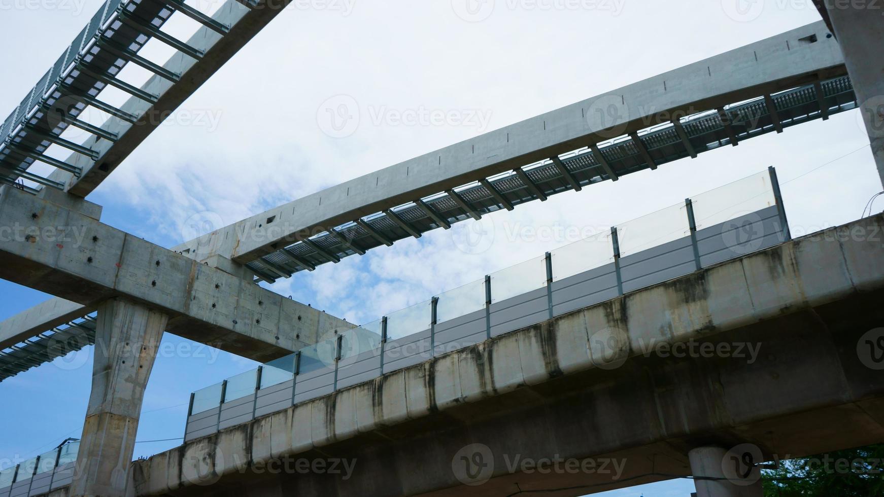 Installation of monorail train on its track elevated over road rapid railway transit system currently under construction photo