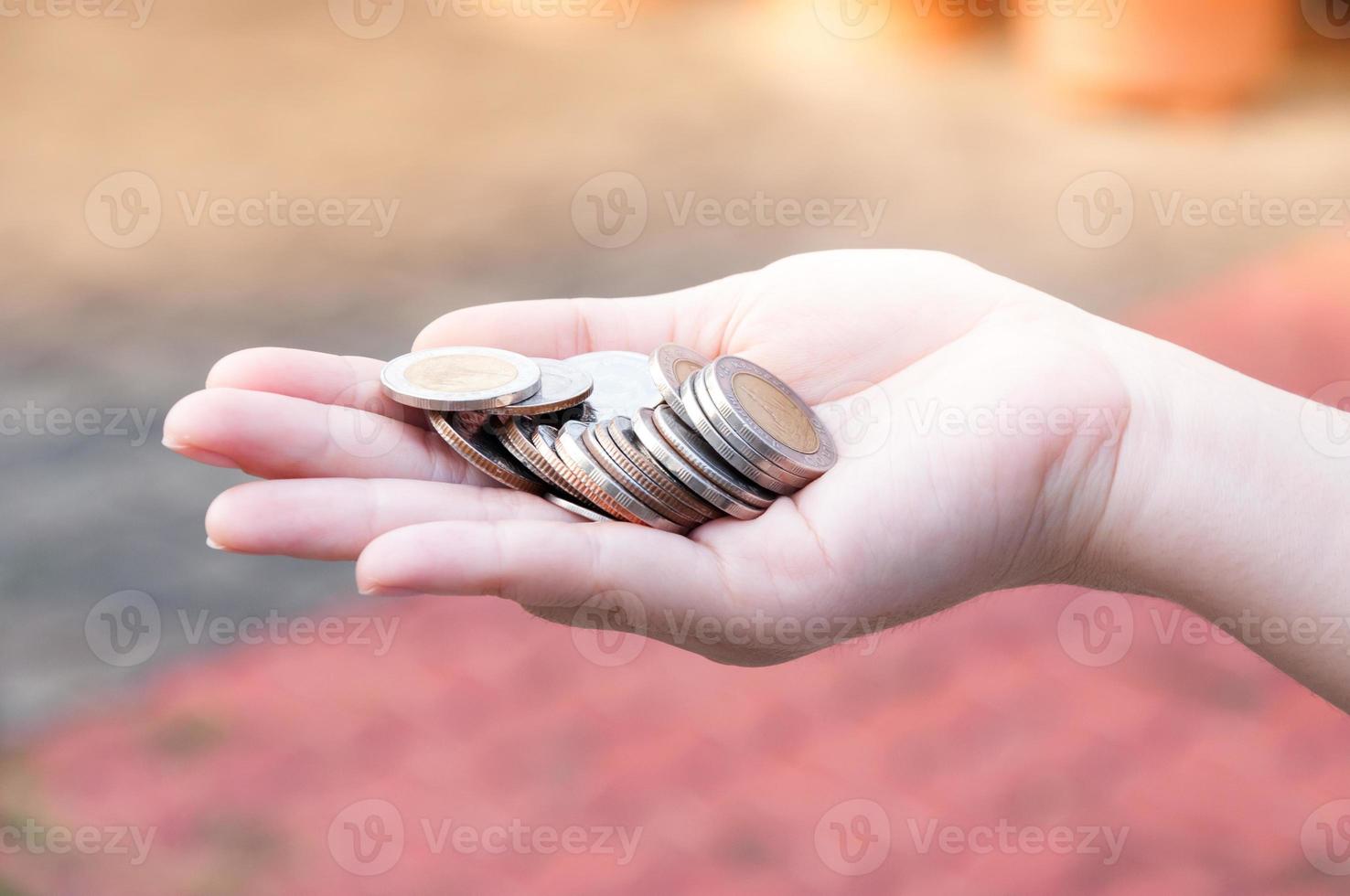 Coins in hands saving,Donation Investment Fund Financial Support Charity  Dividend Market  House Stock Trust Wealthy Giving Planned Accounting Collection Debt Banking ROI photo