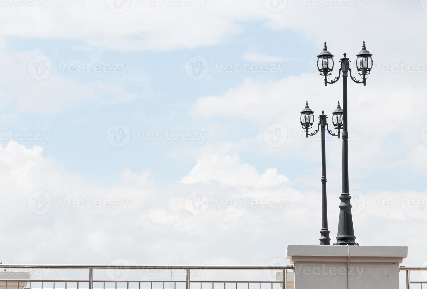 Street lamp retro on blue sky background photo