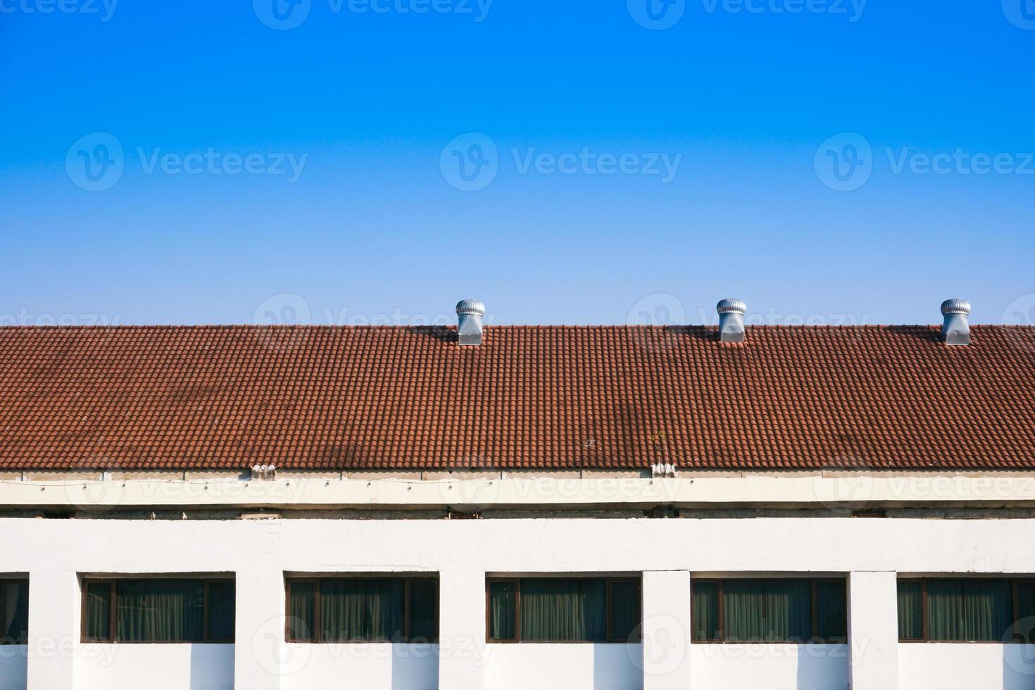 Air Ventilators on the roof top spinning and take cool air into the building photo