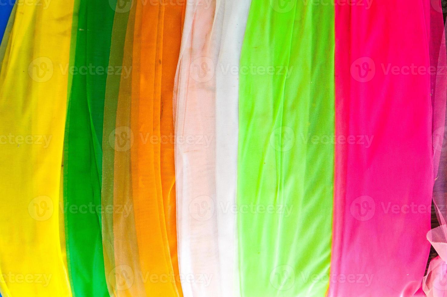 Multi-colored cloth used for decoration in thailand temple,Colorful fabric texture samples photo