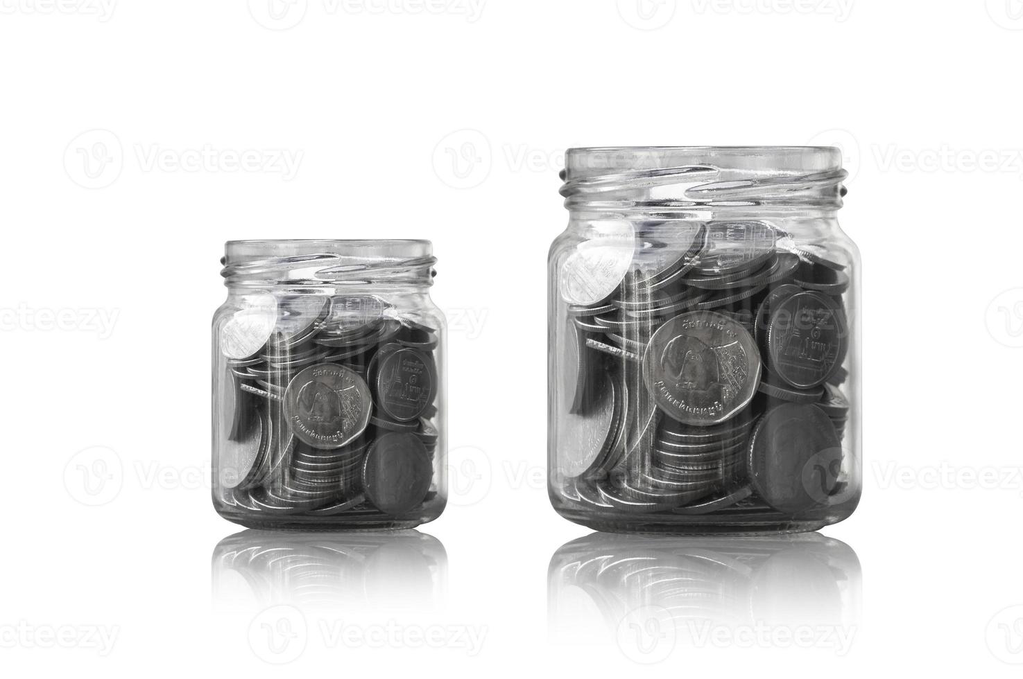 coins in a glass jar against ,savings coins - Investment And Interest Concept saving money concept, growing money on piggy bank. isolated on white background photo