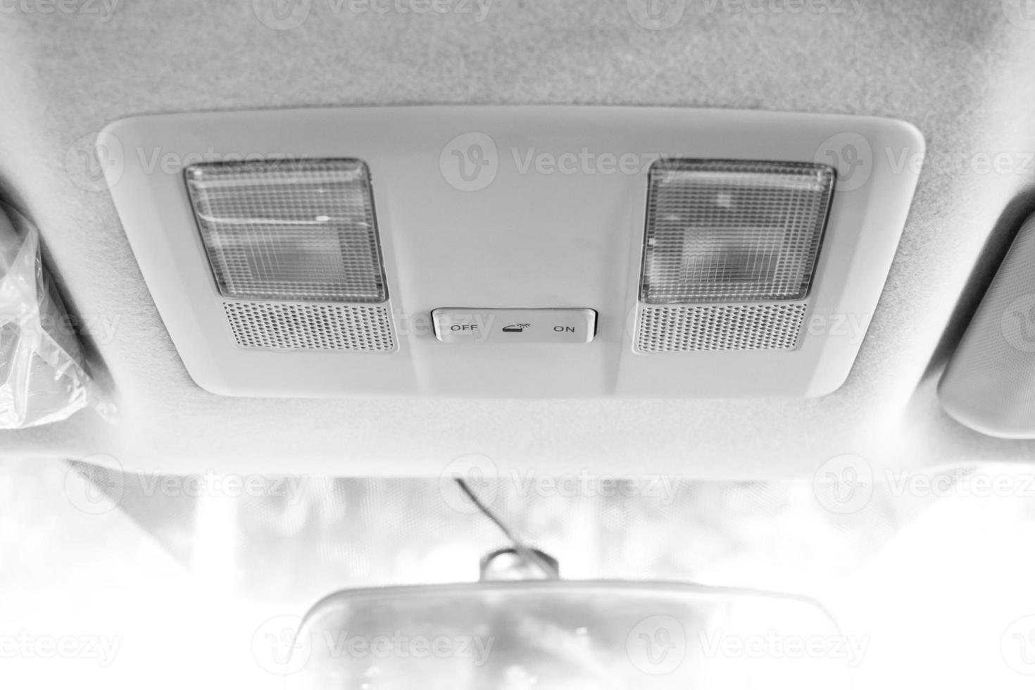 Light at roof in modern car, switch of light, lamp photo