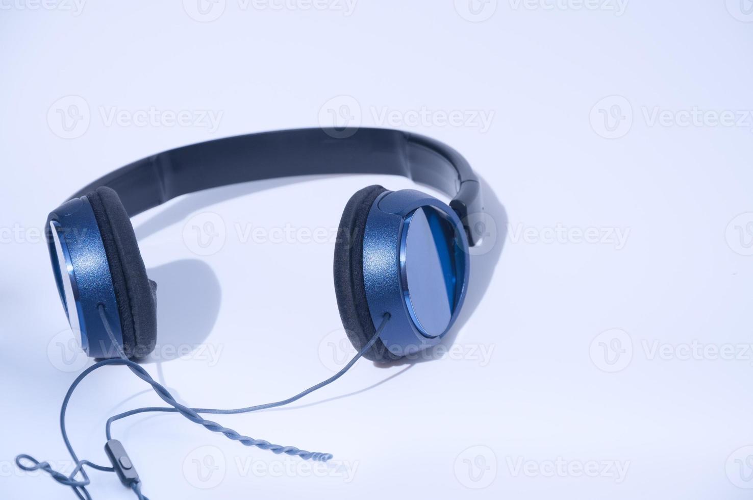 Blue headphones on white background photo