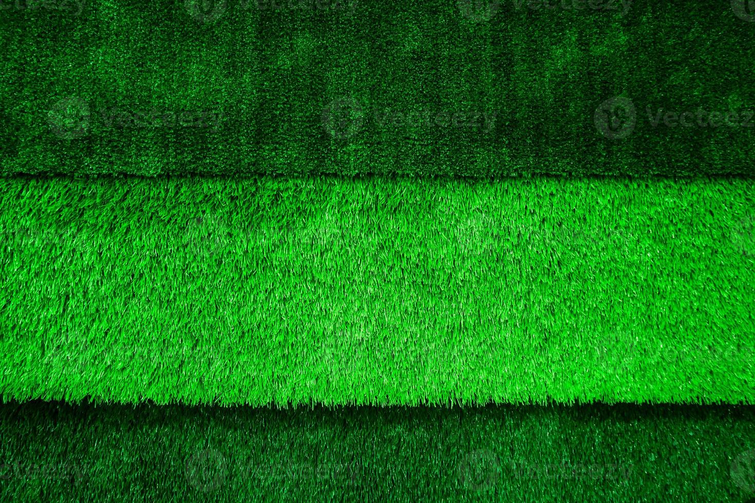 Abstract top view green color of artificial grass background texture photo