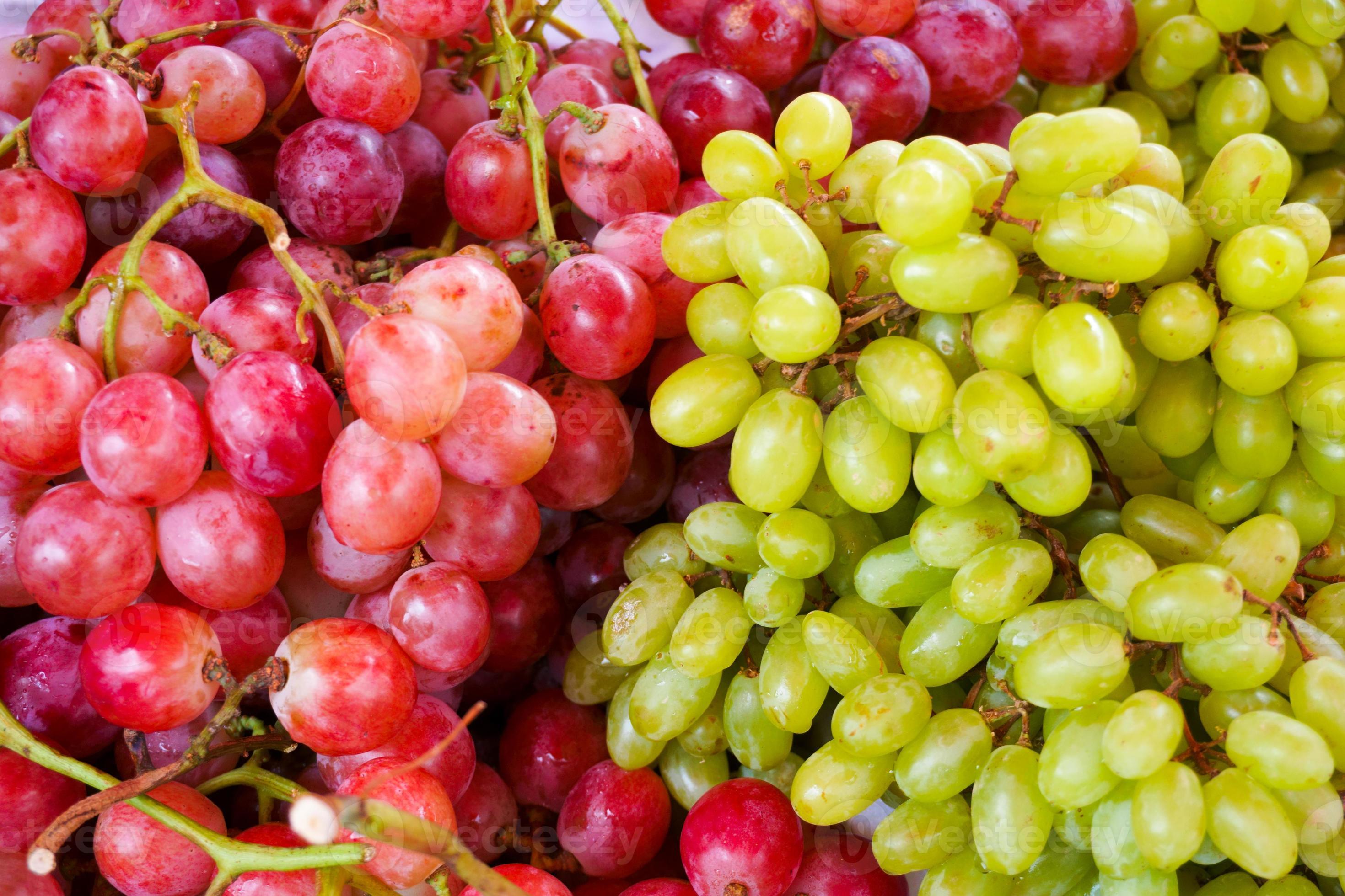 Fresh green and red grapes fruits at maket 19988899 Stock Photo at Vecteezy