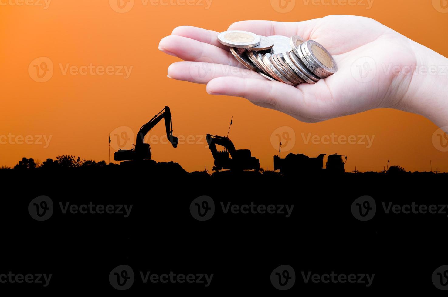 Coins in hands on Industry  silhouette Landscape background,Donation Investment Fund Financial Support Charity  Dividend Market Growth Home House Stock Trust Wealthy Giving Planned Accounting photo