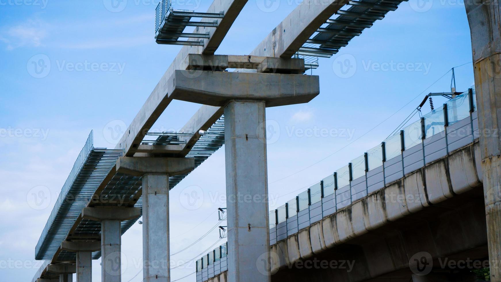 Installation of monorail train on its track elevated over road rapid railway transit system currently under construction photo