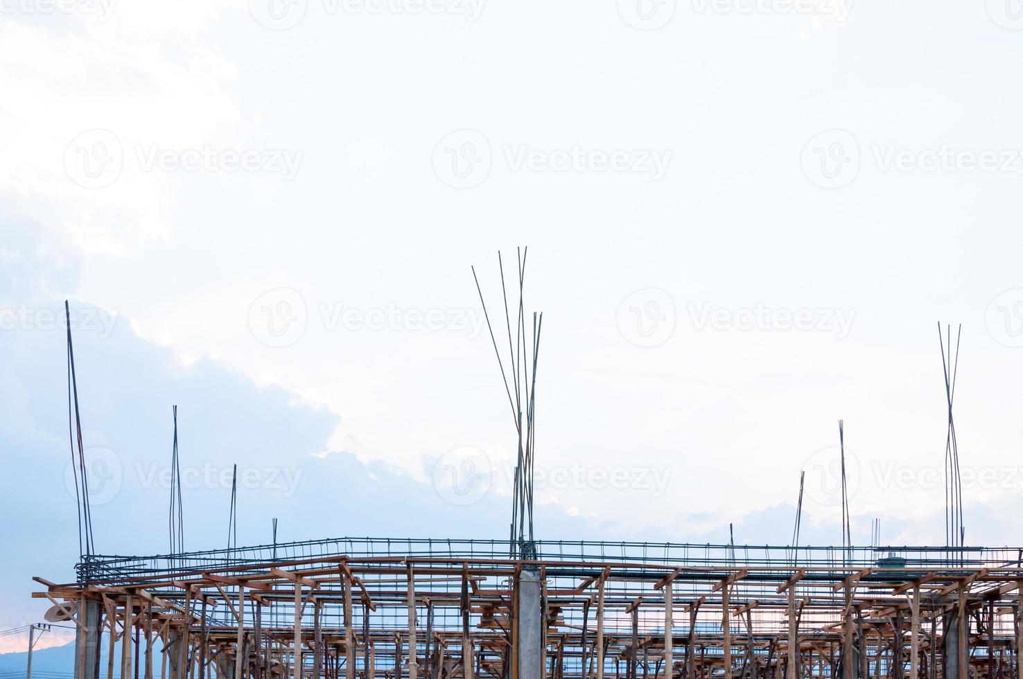 Construction site view of scaffolding poles on building site photo