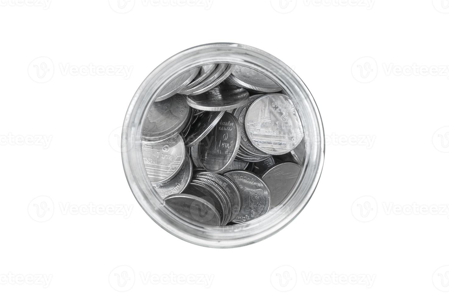 coins in a glass jar against top view ,savings coins - Investment And Interest Concept saving money concept, growing money on piggy bank. isolated on white background photo