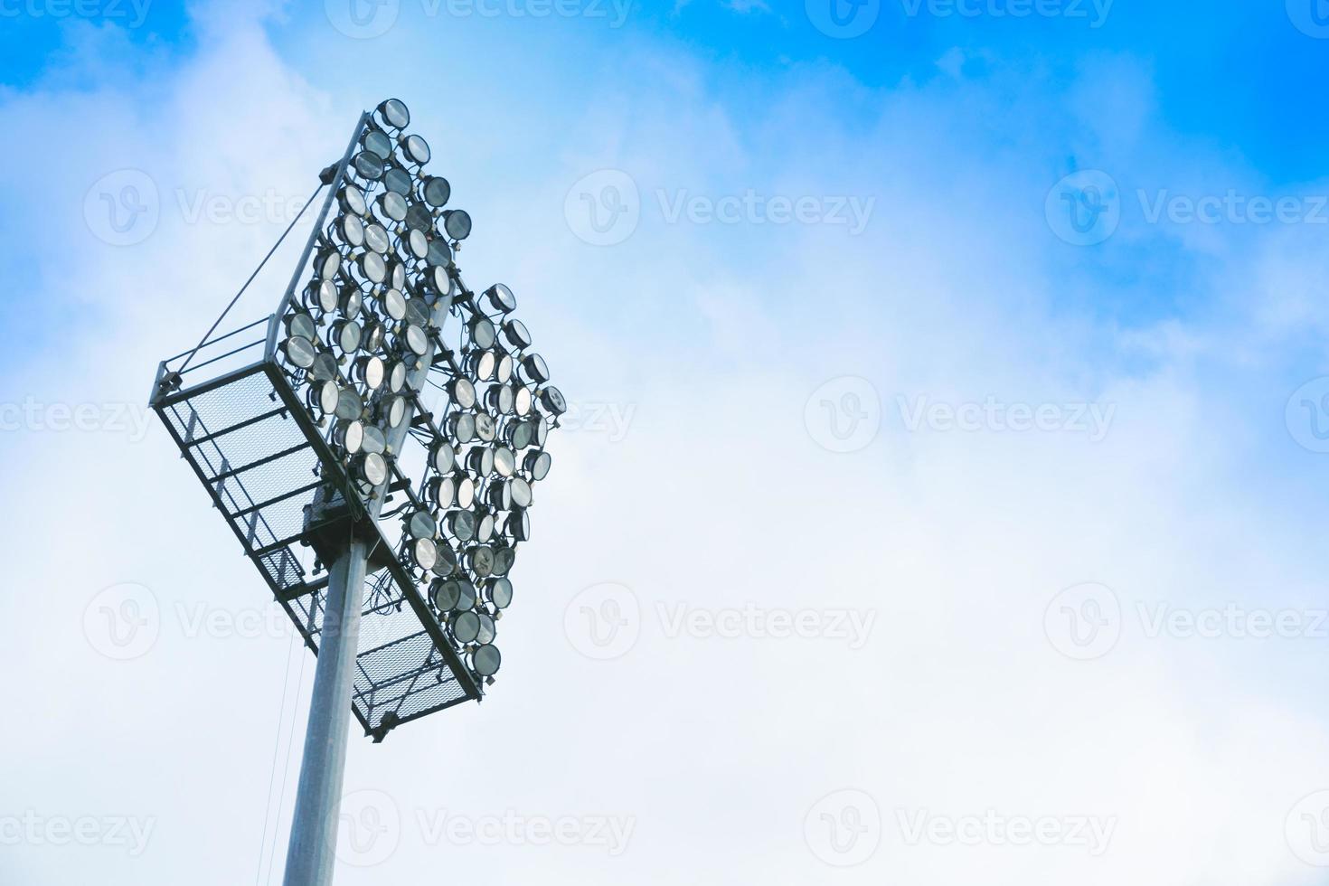 Large spotlight, Lights for the stadium on beautiful bright sky photo