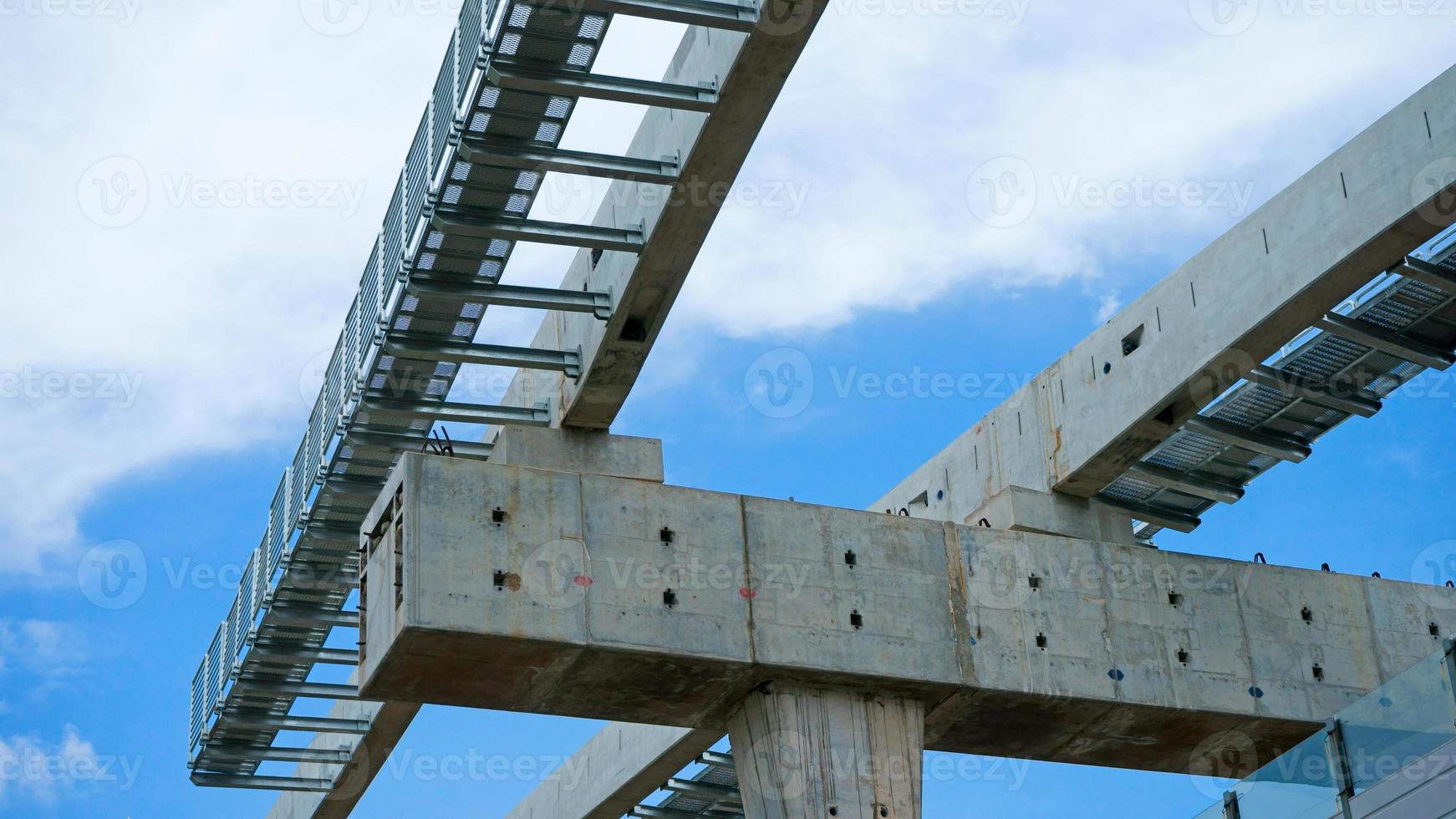 Installation of monorail train on its track elevated over road rapid railway transit system currently under construction photo