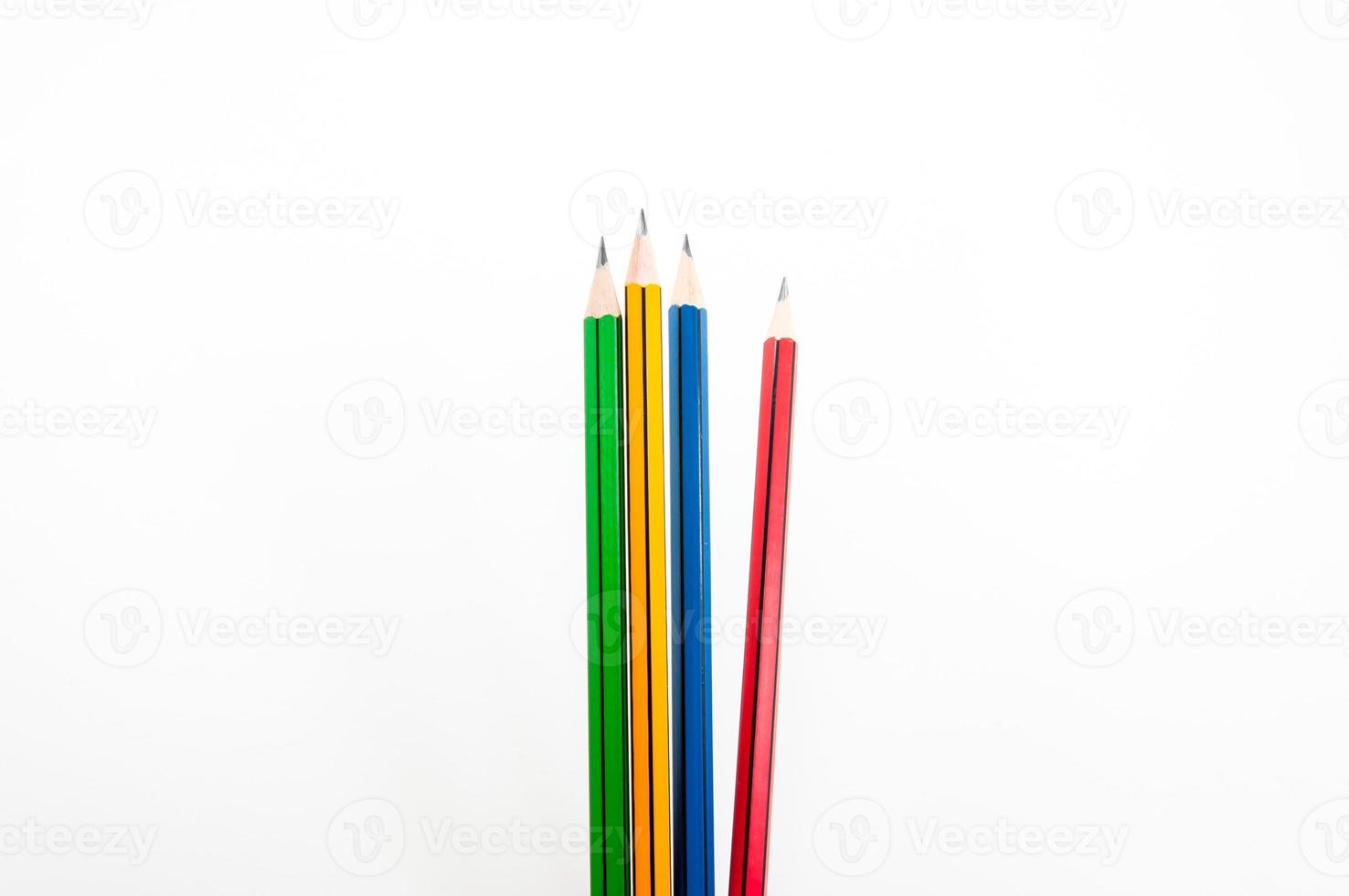 Colorful Pencil  in fist   power of written word on white background photo