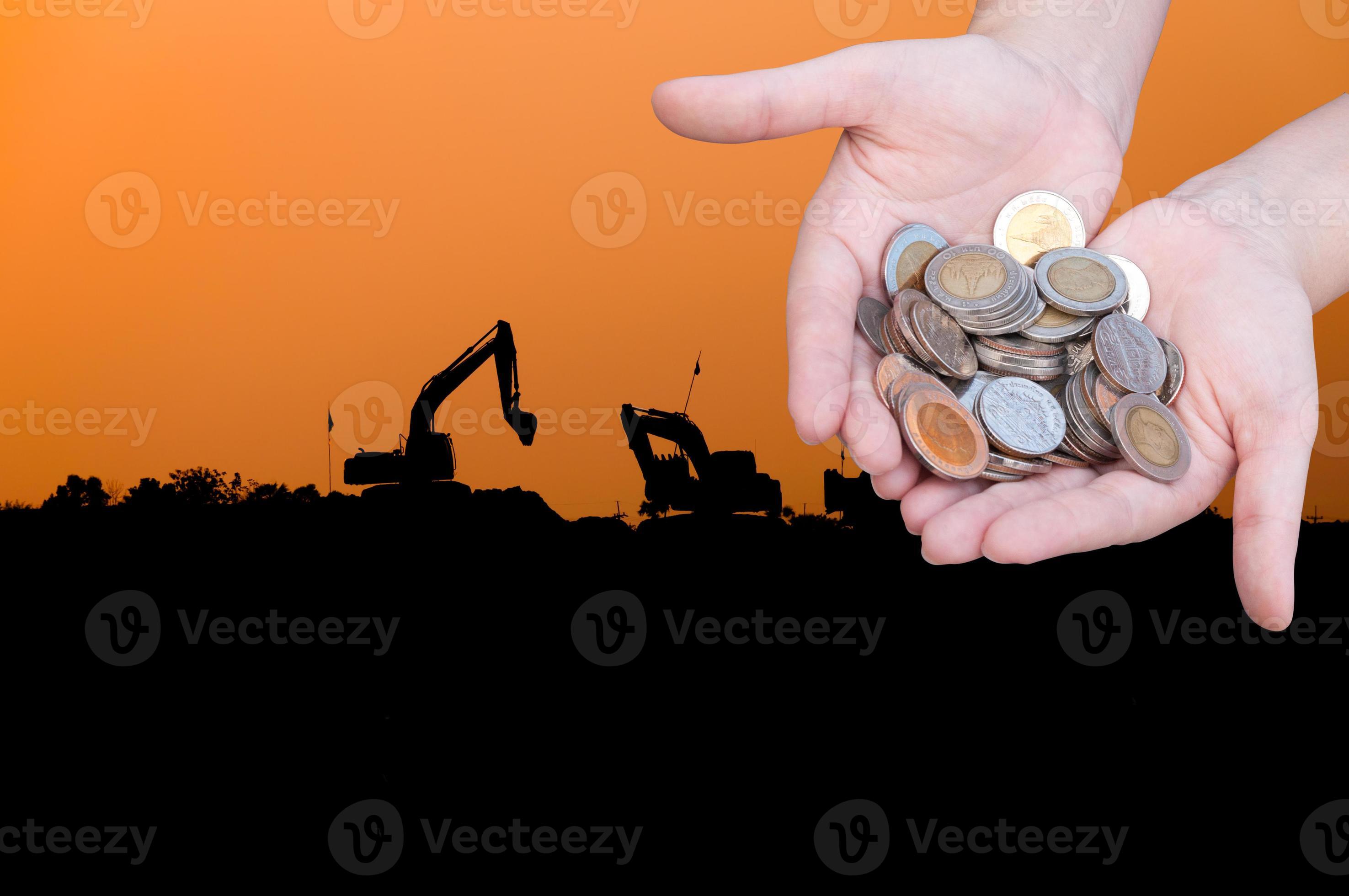 Coins in hands on Industry silhouette Landscape background,Donation