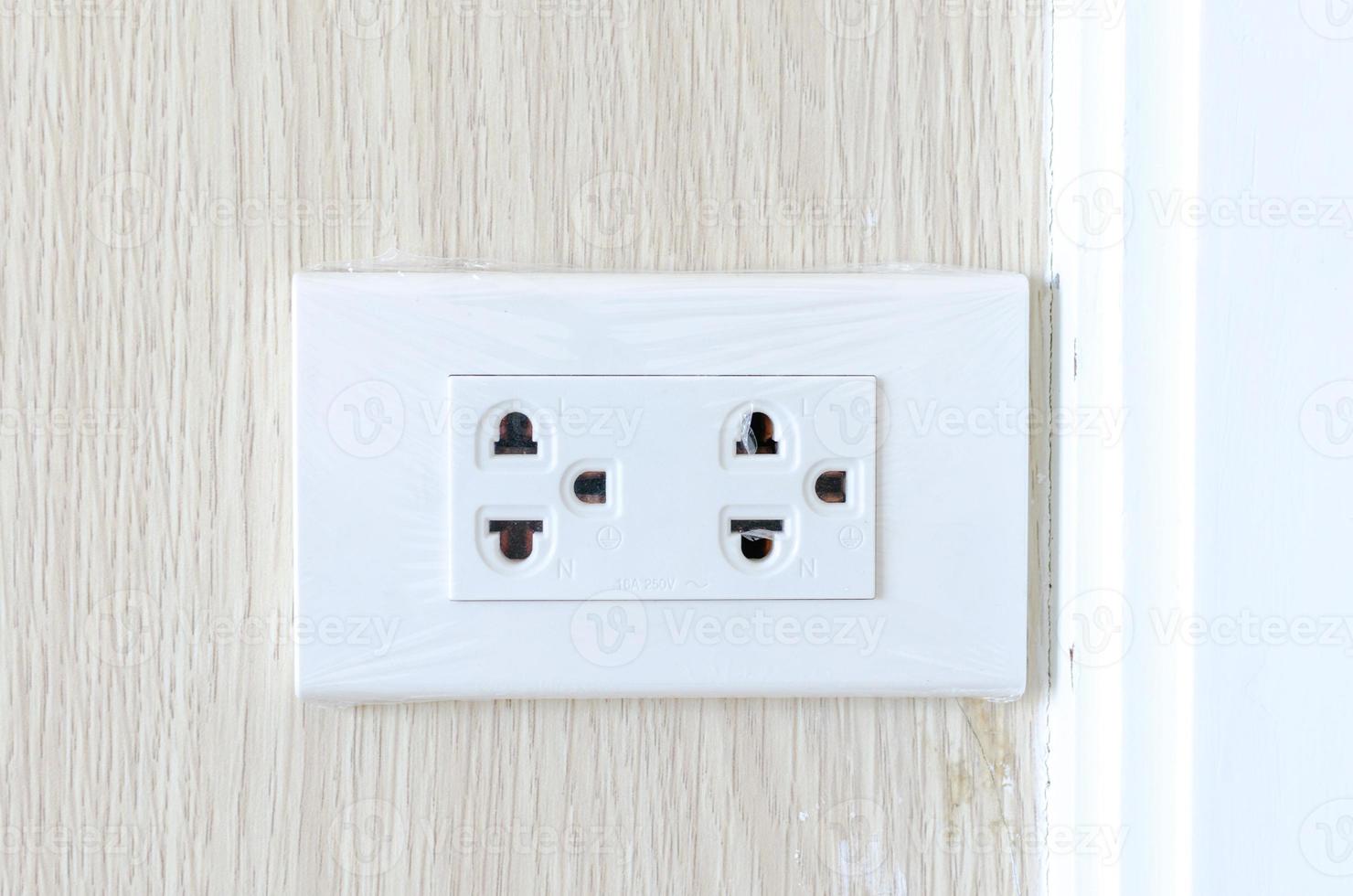 Electrical socket plug  on wall photo