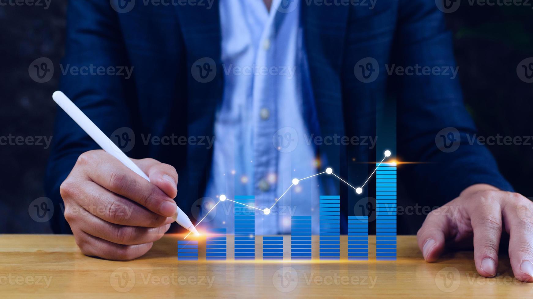 Businessman stylus pen touch points symbol stock graph and chart background, concept growth and development business investment, Stock market and strategy making market plan photo